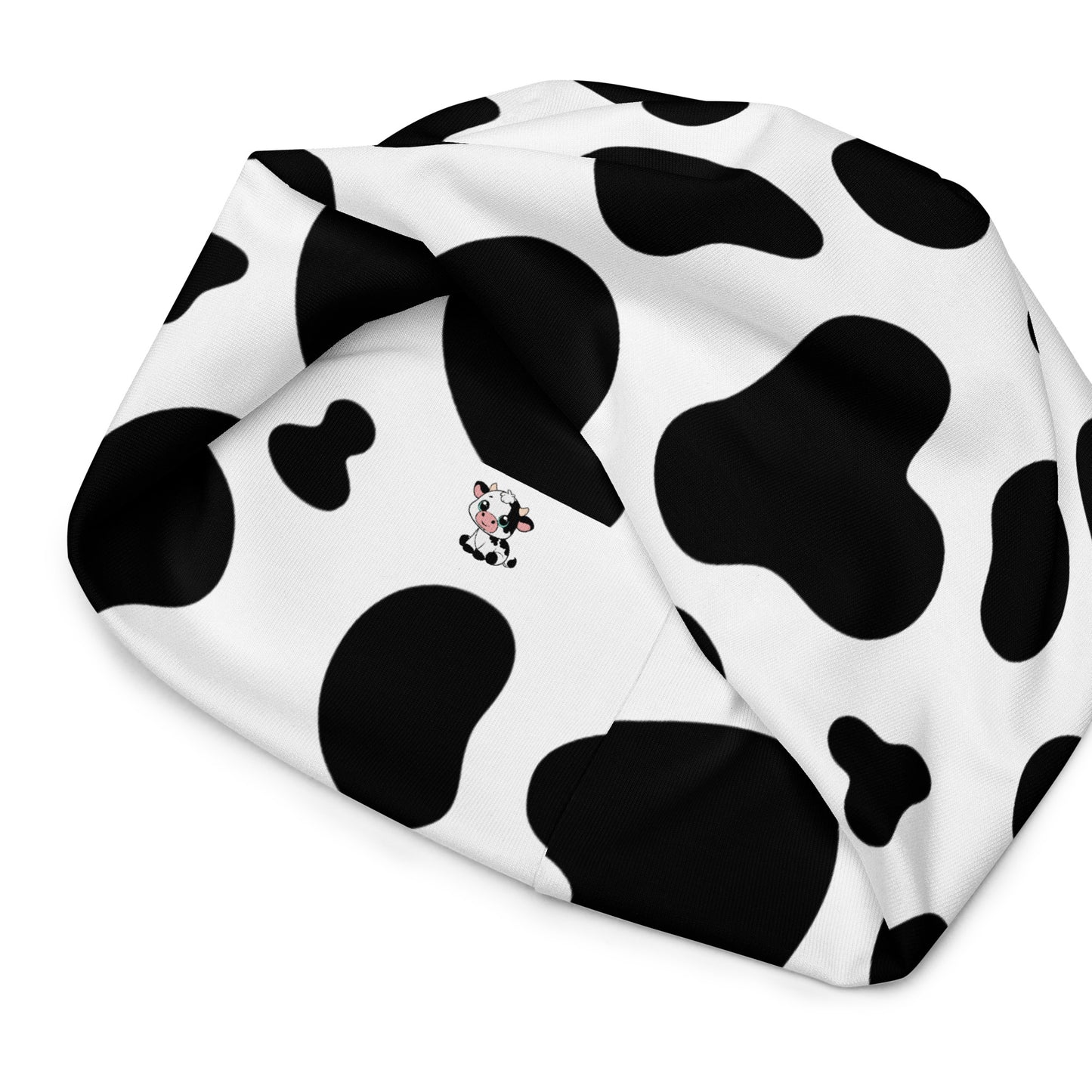 Unisex cow print beanie hat in black and white, soft double-layer knit, inside view
