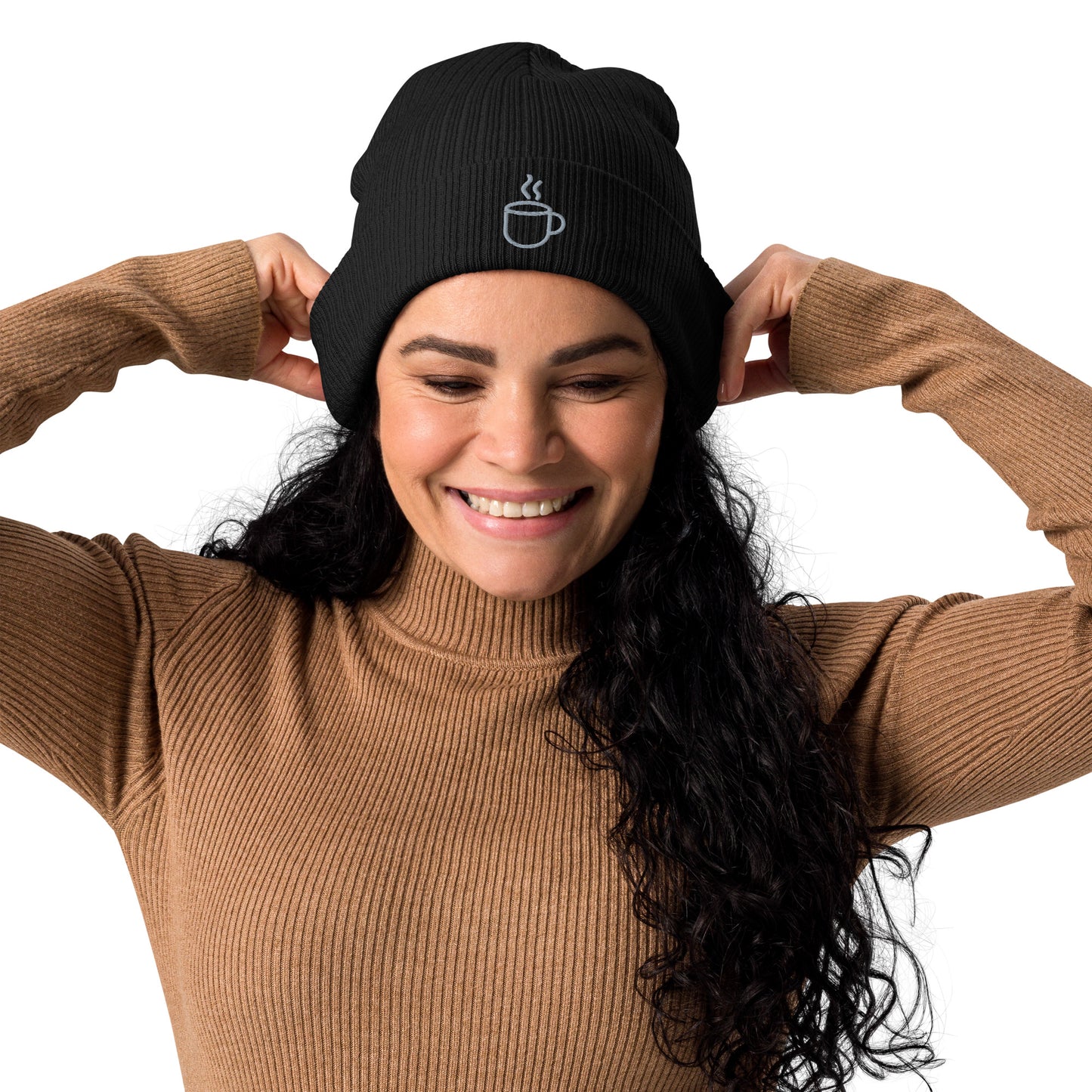 Model wearing ribbed knit beanie hat in black with embroidered coffee cup design, front view