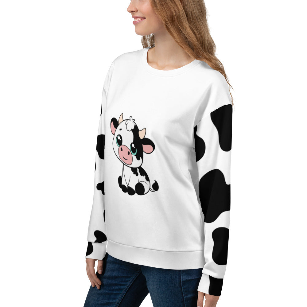Model wearing unisex cow patch sweatshirt in white with black cow print pattern and cute cow illustration on front, side view – quirky countryside jumper