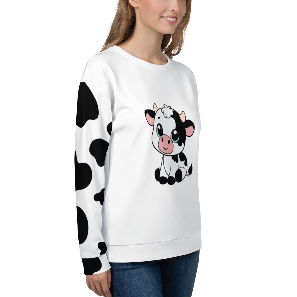 Model wearing unisex cow patch sweatshirt in white with black cow print pattern and cute cow illustration on front, side view – quirky countryside jumper