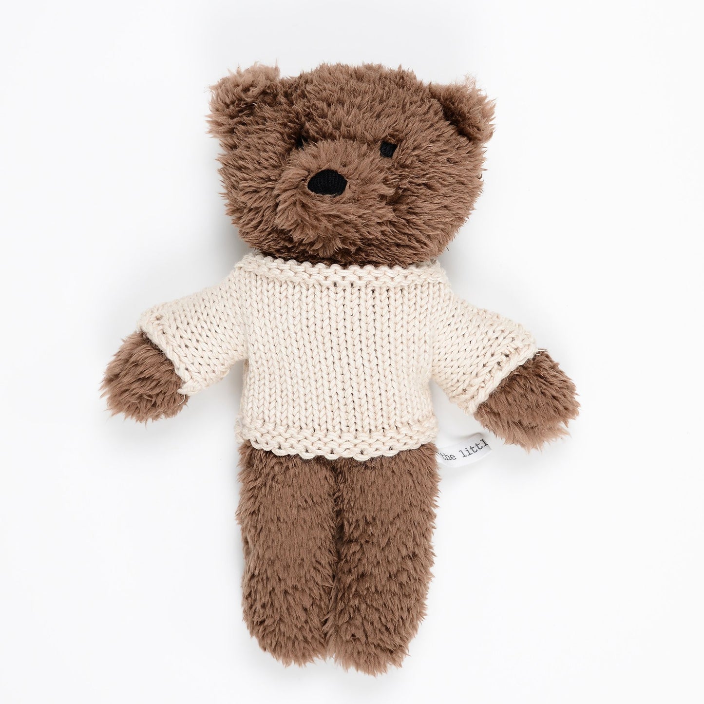 Chocolate plush teddy bear wearing cream merino wool sweater on white background – Mamutino