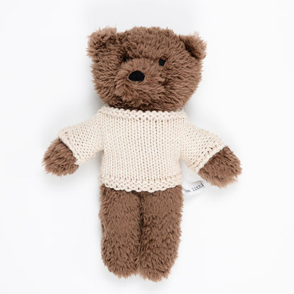 Chocolate plush teddy bear wearing cream merino wool sweater on white background – Mamutino