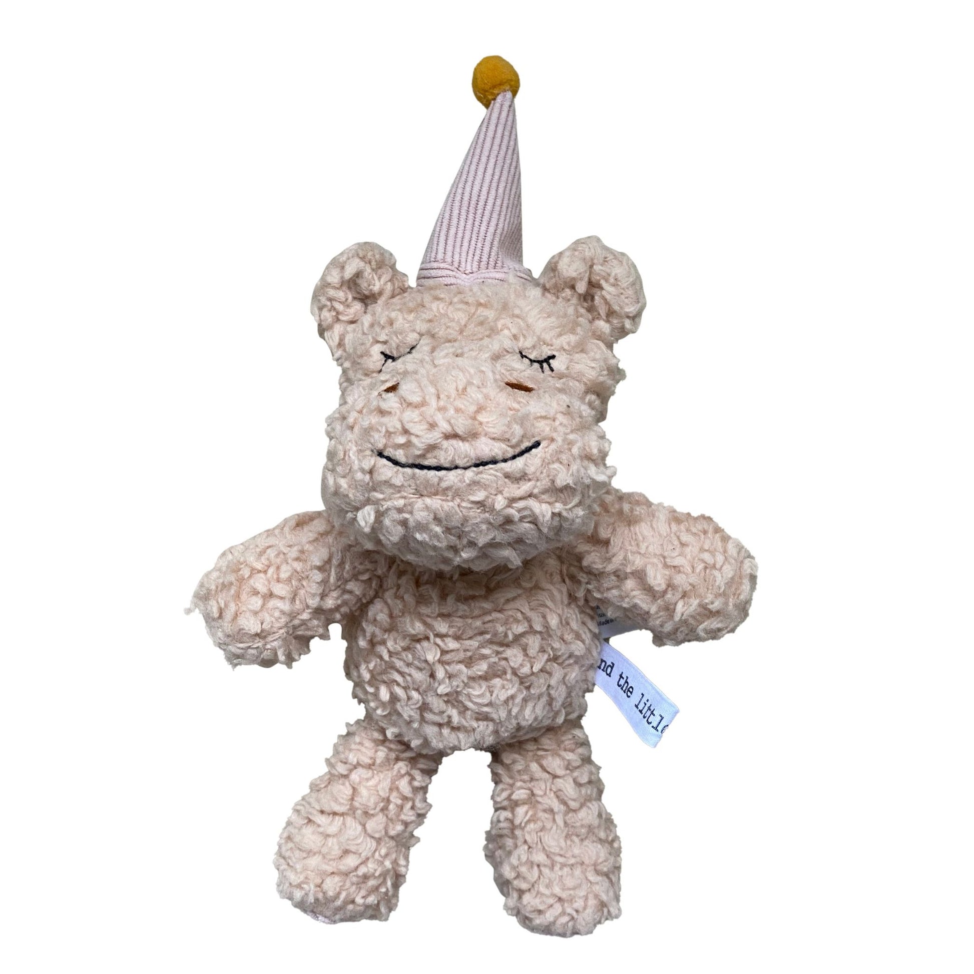 Cotton plush hippo toy with party hat and mustard pom-pom on white background – Mamutino
