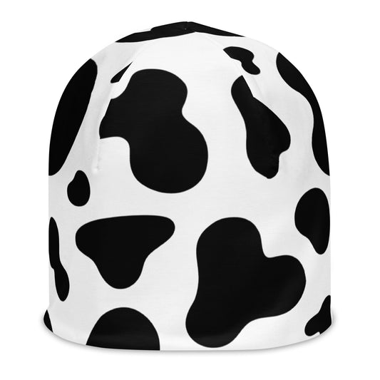Unisex cow print beanie hat in black and white, soft double-layer knit, front view